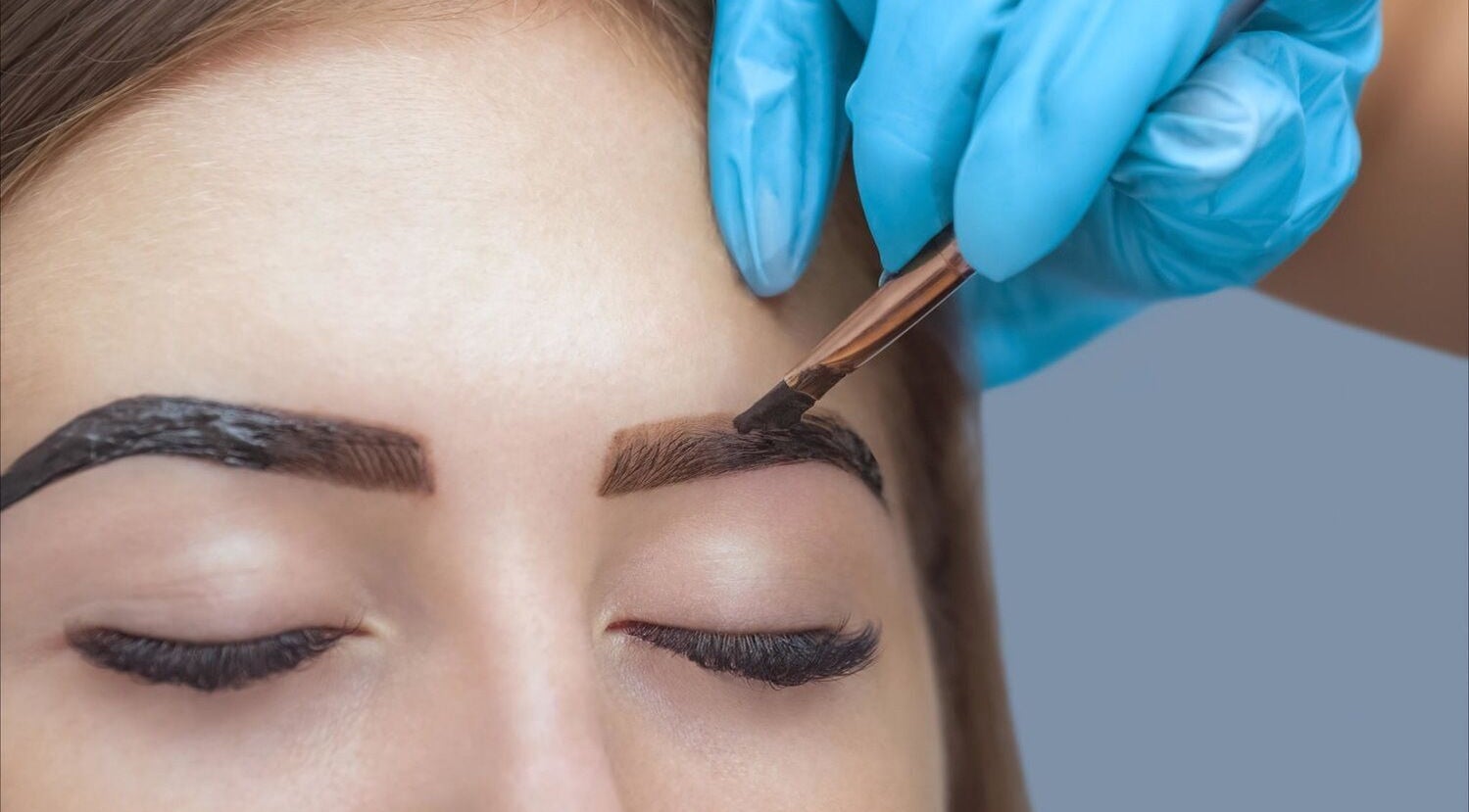 Eyebrow tinting at Luxe Aesthetics in Ajax, Ontario, CA, showcasing expert application for defined brows.