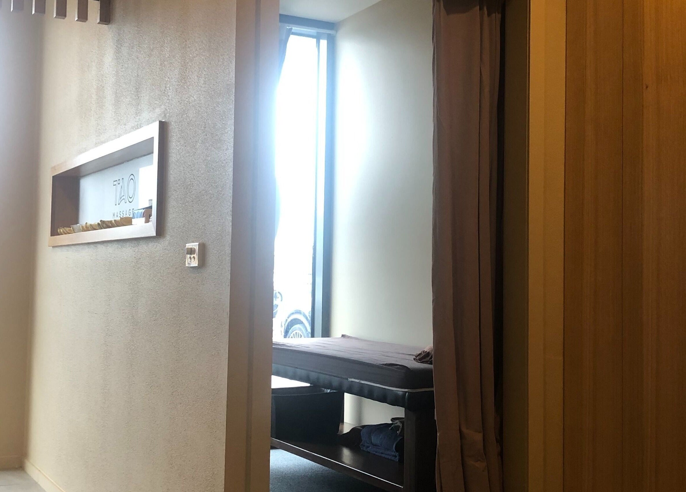 Tranquil massage room at Tao Massage Maddingley, Bacchus Marsh, Victoria, AU, featuring natural lighting.