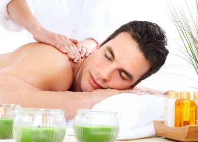 Relaxing massage at Massage Season in Gaithersburg, Maryland, US, with soothing green candles.