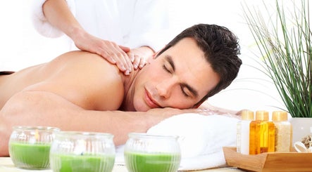 Relaxing massage at Massage Season in Gaithersburg, Maryland, US, with soothing green candles.