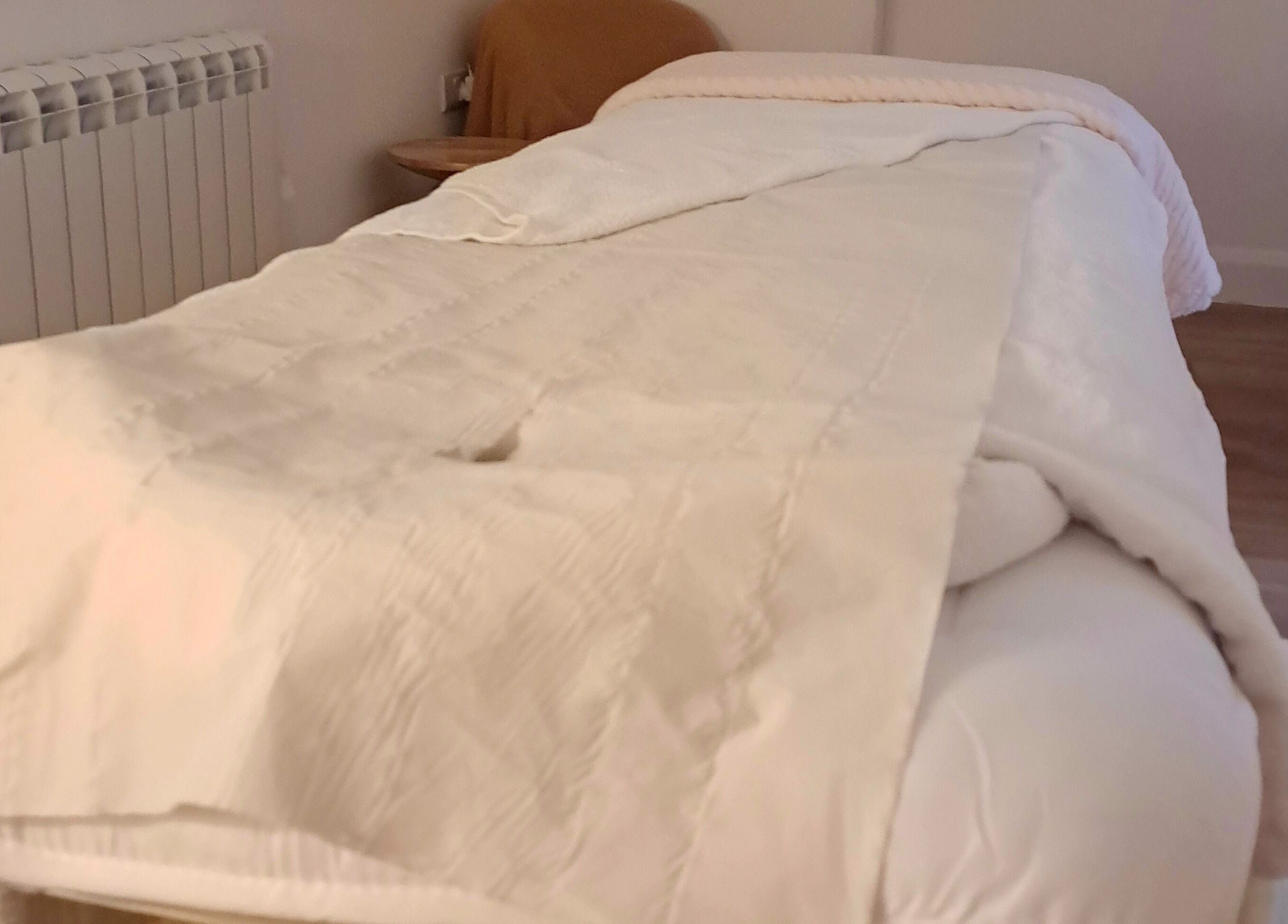 Cozy massage room at Blossom Leaf, Bognor Regis, England, GB with a comfortable bed and serene ambiance.