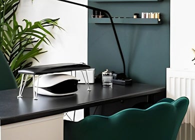 Flos’ Beauty Box in Stroud, England, GB features a modern desk with a chair and greenery for a serene environment.
