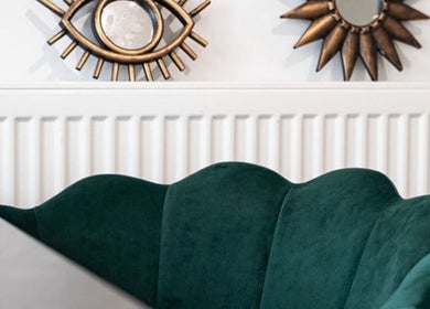 Stylish green velvet chair and ornate wall mirrors at Flos’ Beauty Box, Stroud, England, GB.