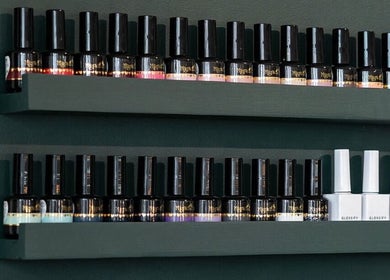 Elegant nail polish display at Flos’ Beauty Box, Stroud, England, GB, showcasing diverse polish colors.