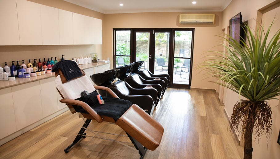 Elegant salon chairs at h.AIRLAB Balmain, Balmain East, New South Wales, AU, ready for a luxurious hair treatment.