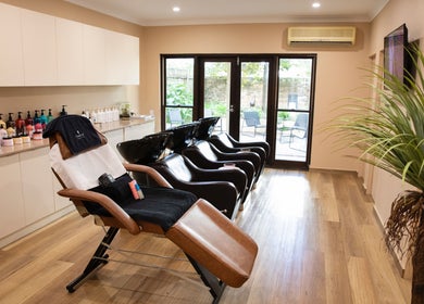 Elegant salon chairs at h.AIRLAB Balmain, Balmain East, New South Wales, AU, ready for a luxurious hair treatment.