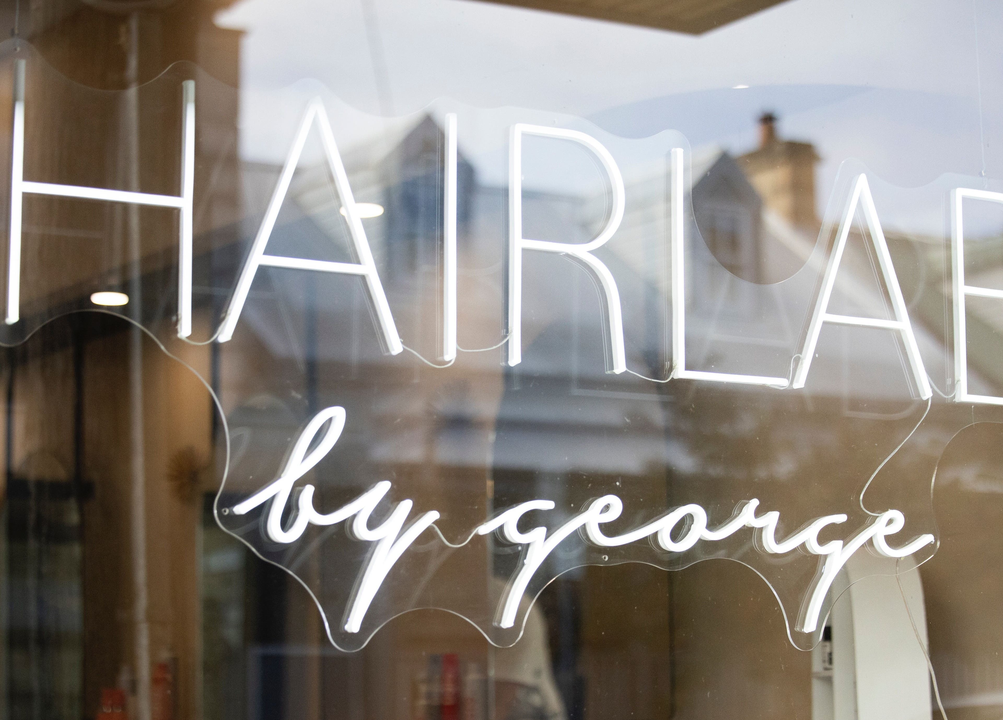 h.AIRLAB Balmain neon sign at Balmain East, New South Wales, AU, showcasing its stylish branding.