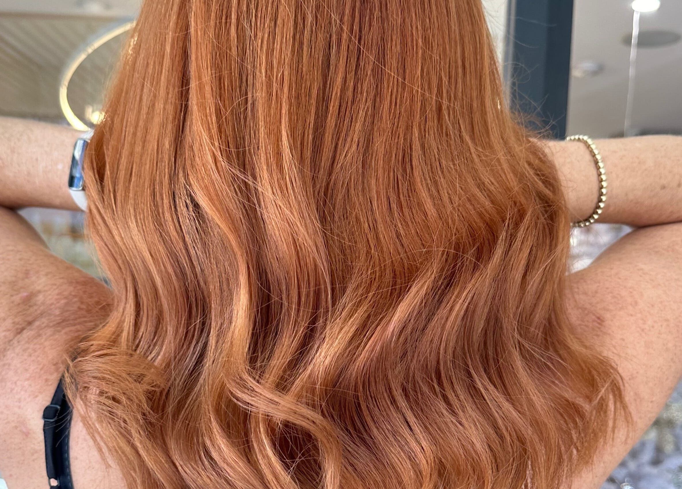 Vibrant red hair styled in waves at h.AIRLAB Balmain, Balmain East, New South Wales, AU salon.