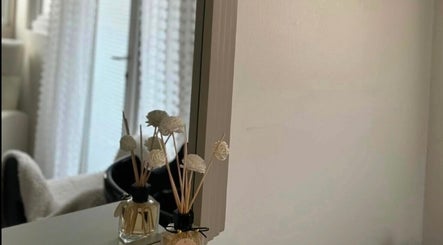 Stylish mirror with decor at House of Beauty, Lydd, England, GB showcasing serene ambiance.