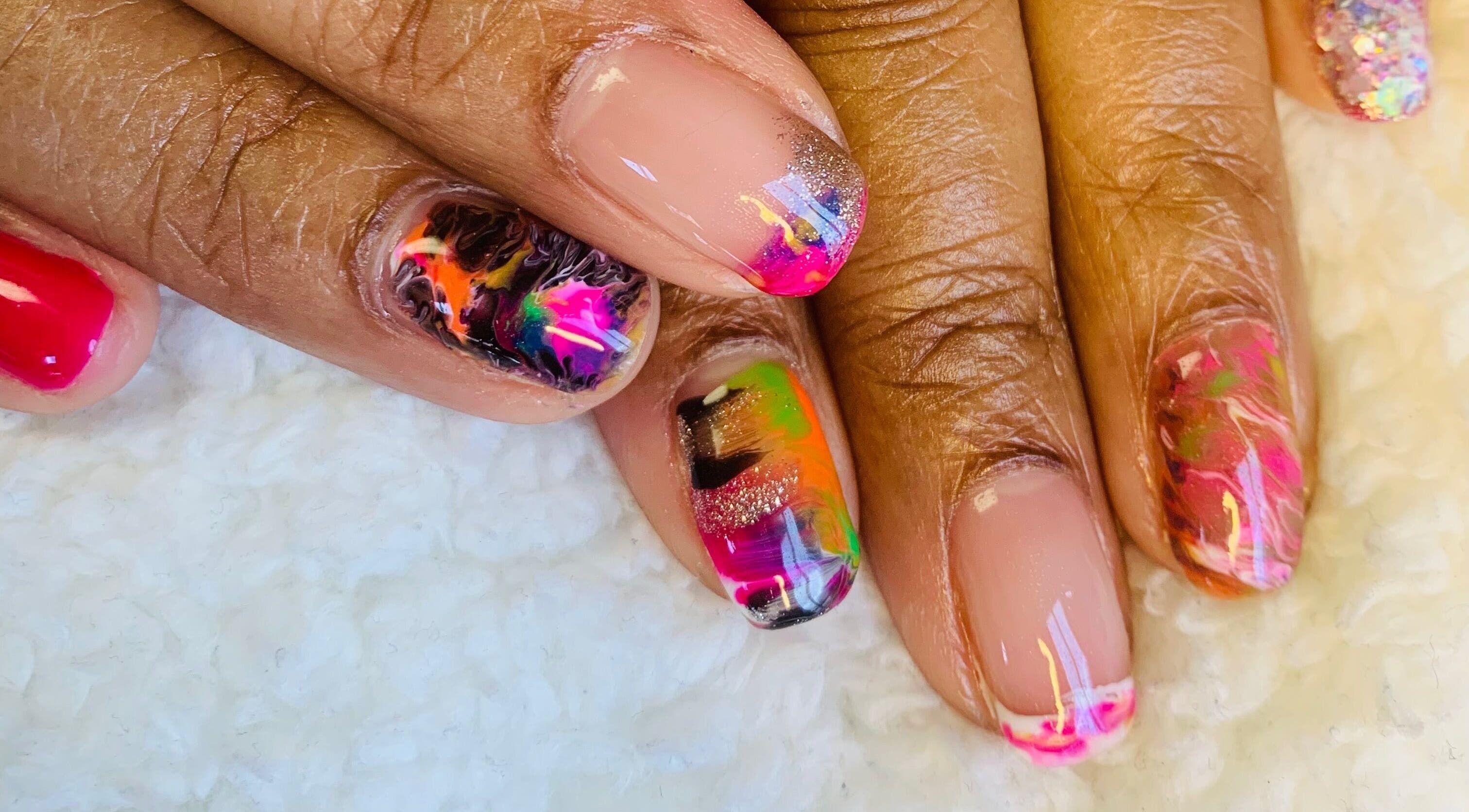 Colorful nail art design at Simply You Salon & LLC in Parma, Ohio, US, showcasing vibrant artistry.