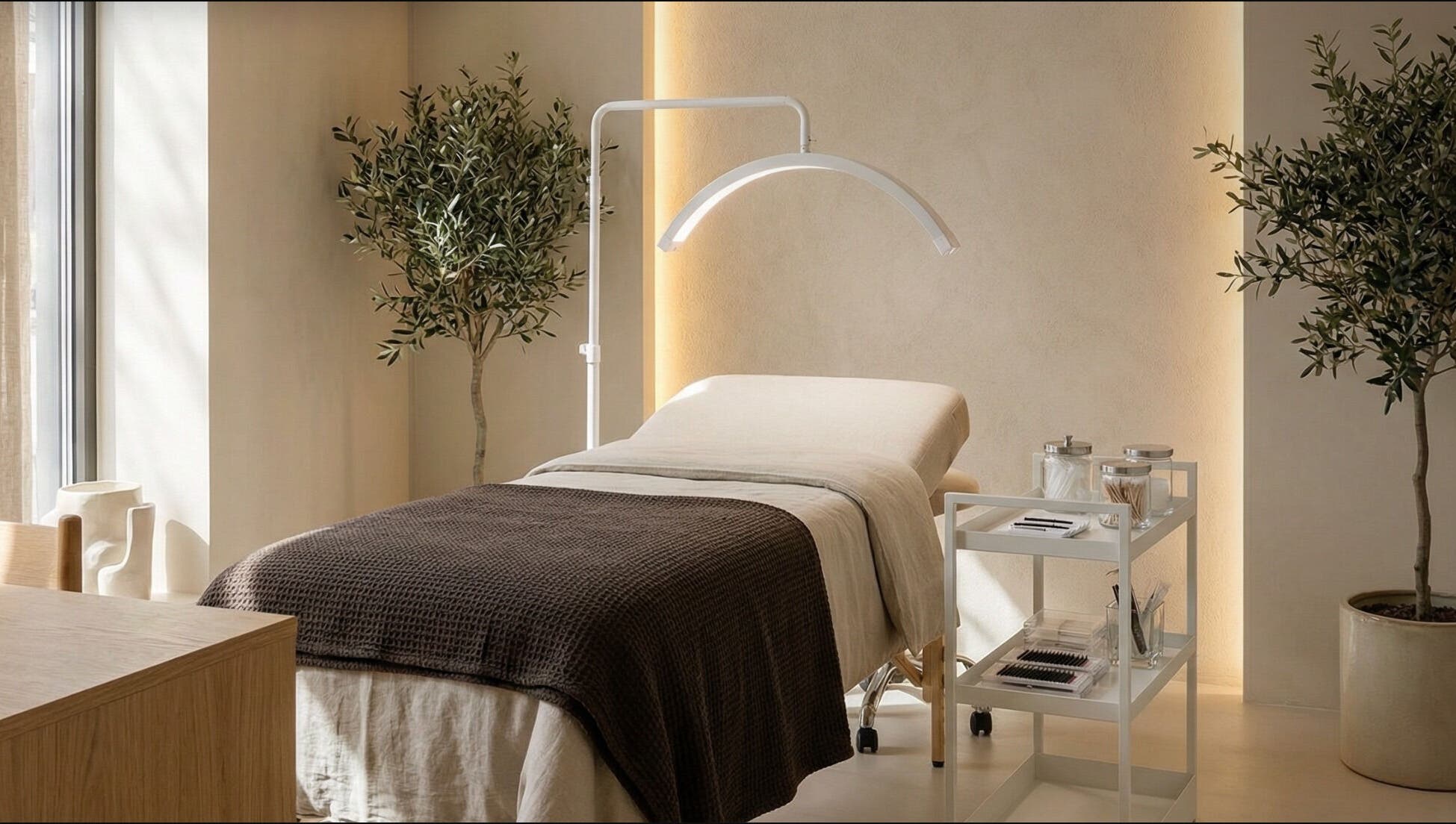 Relaxing spa room at Slay Beauté Studio, Oakville, Ontario, CA, with treatment bed and calming ambiance.