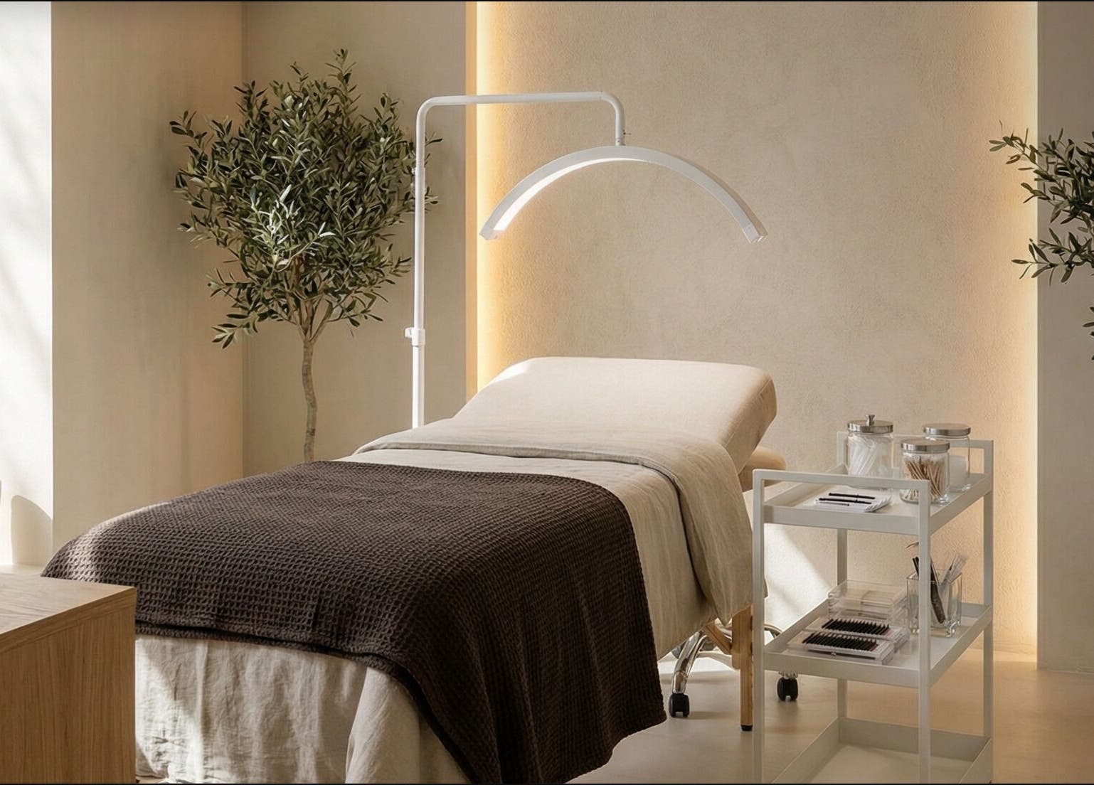 Relaxing spa room at Slay Beauté Studio, Oakville, Ontario, CA, with treatment bed and calming ambiance.