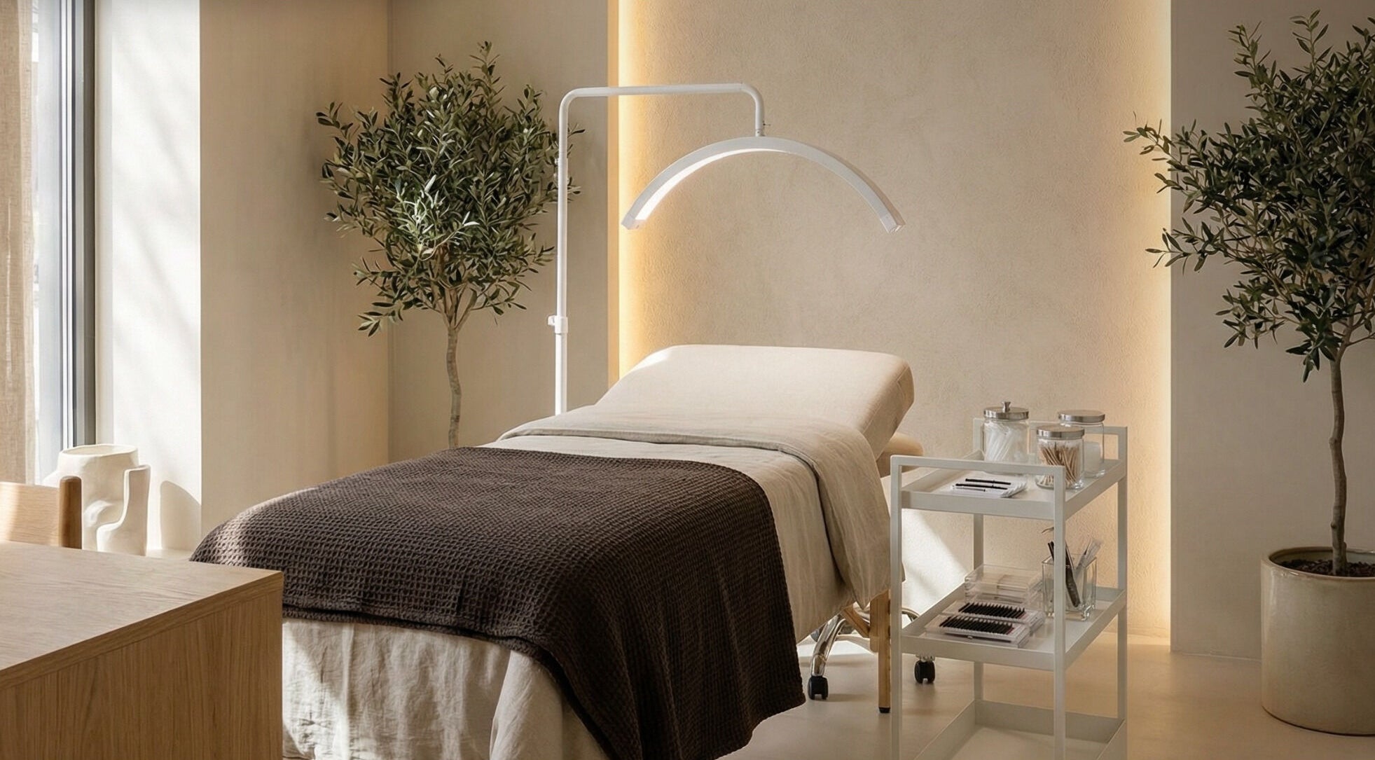 Relaxing spa room at Slay Beauté Studio, Oakville, Ontario, CA, with treatment bed and calming ambiance.