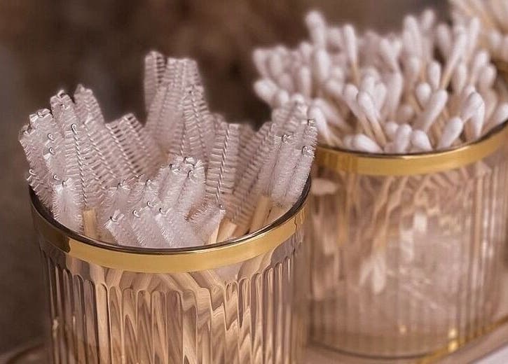 Elegant brush and swab holders at Slay Beauté Studio in Oakville, Ontario, CA for luxury beauty services.