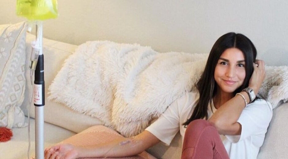 Woman enjoying IV therapy at Trio Pilates Vitamin Injection Pop up, Bridgewater, Massachusetts, US.