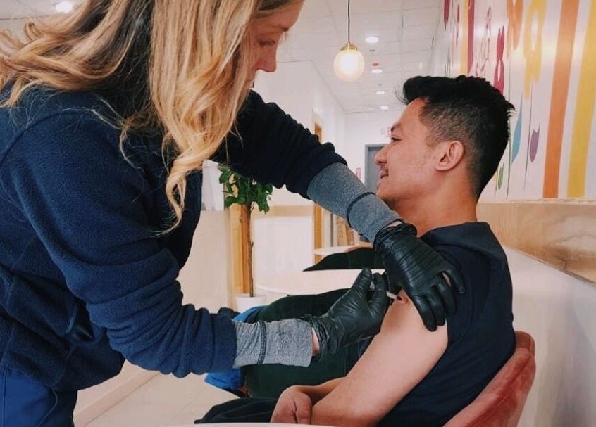 Professional administering injection at Vitamin Injection Pop Up 1st Saturday of the Month, Raynham, Massachusetts, US.