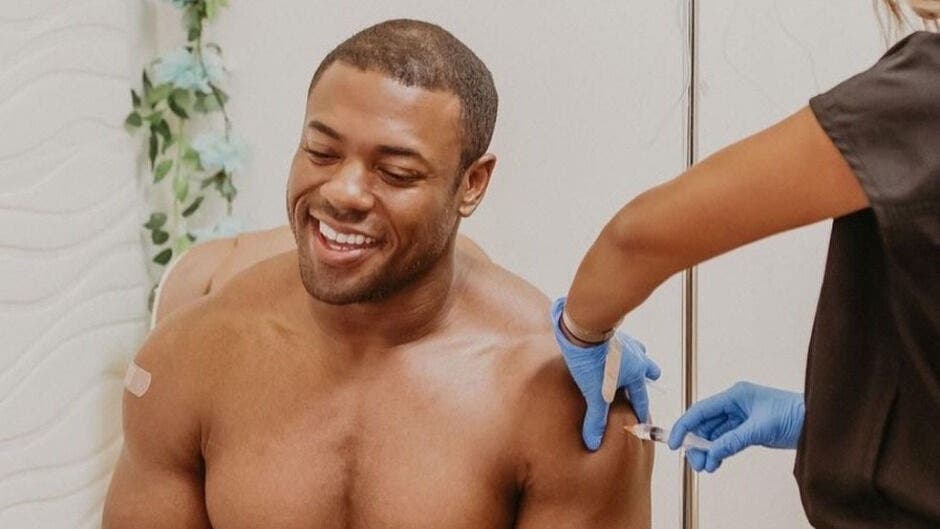 Smiling man receiving treatment at Beyond Aesthetics Tuesdays in Westport, Massachusetts, US.