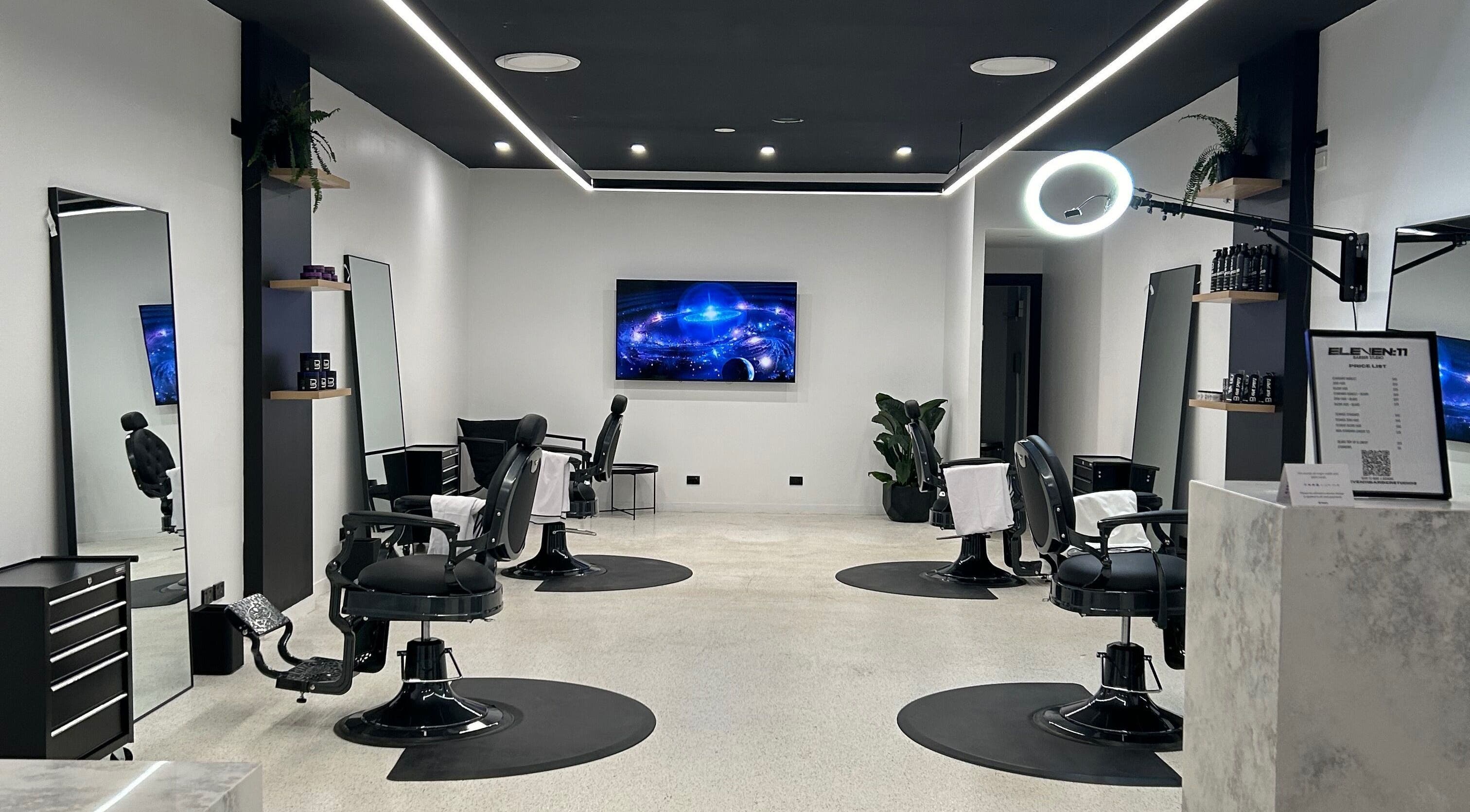 Modern interior of Eleven 11 Barber Studios in Coomera, Queensland, AU, featuring stylish barber chairs and sleek design.
