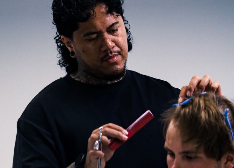 Barber skillfully shaping hair at Eleven 11 Barber Studios, Coomera, Queensland, AU.