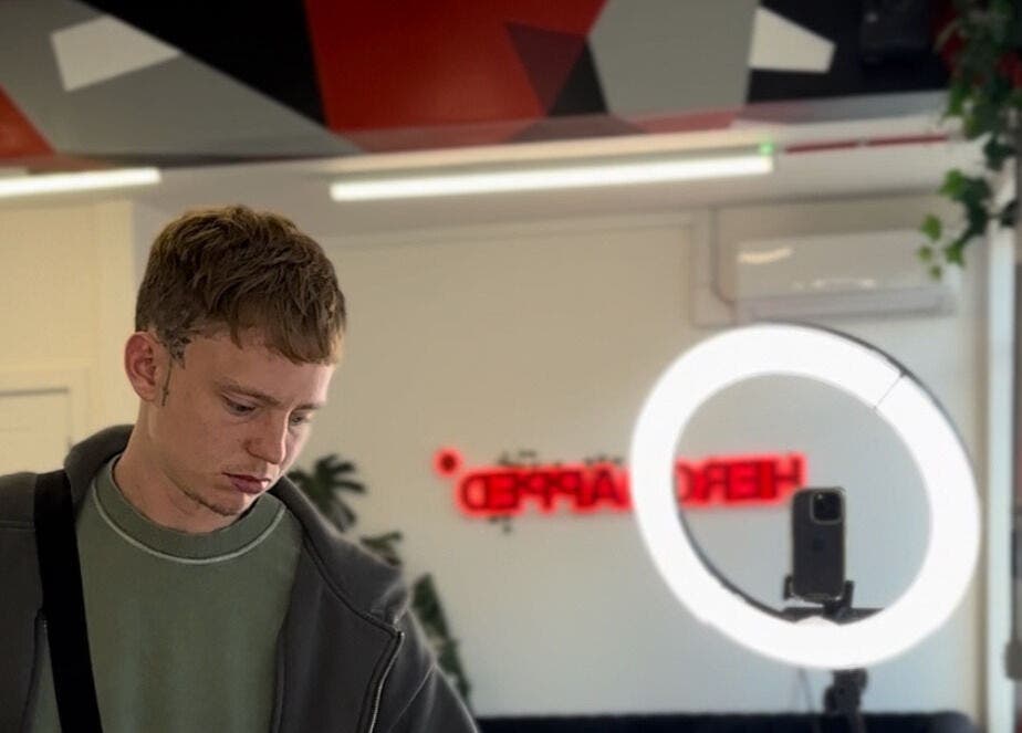 Interior of HeroGapped Barber Studio in Bognor Regis, England with modern decor and a ring light setup.