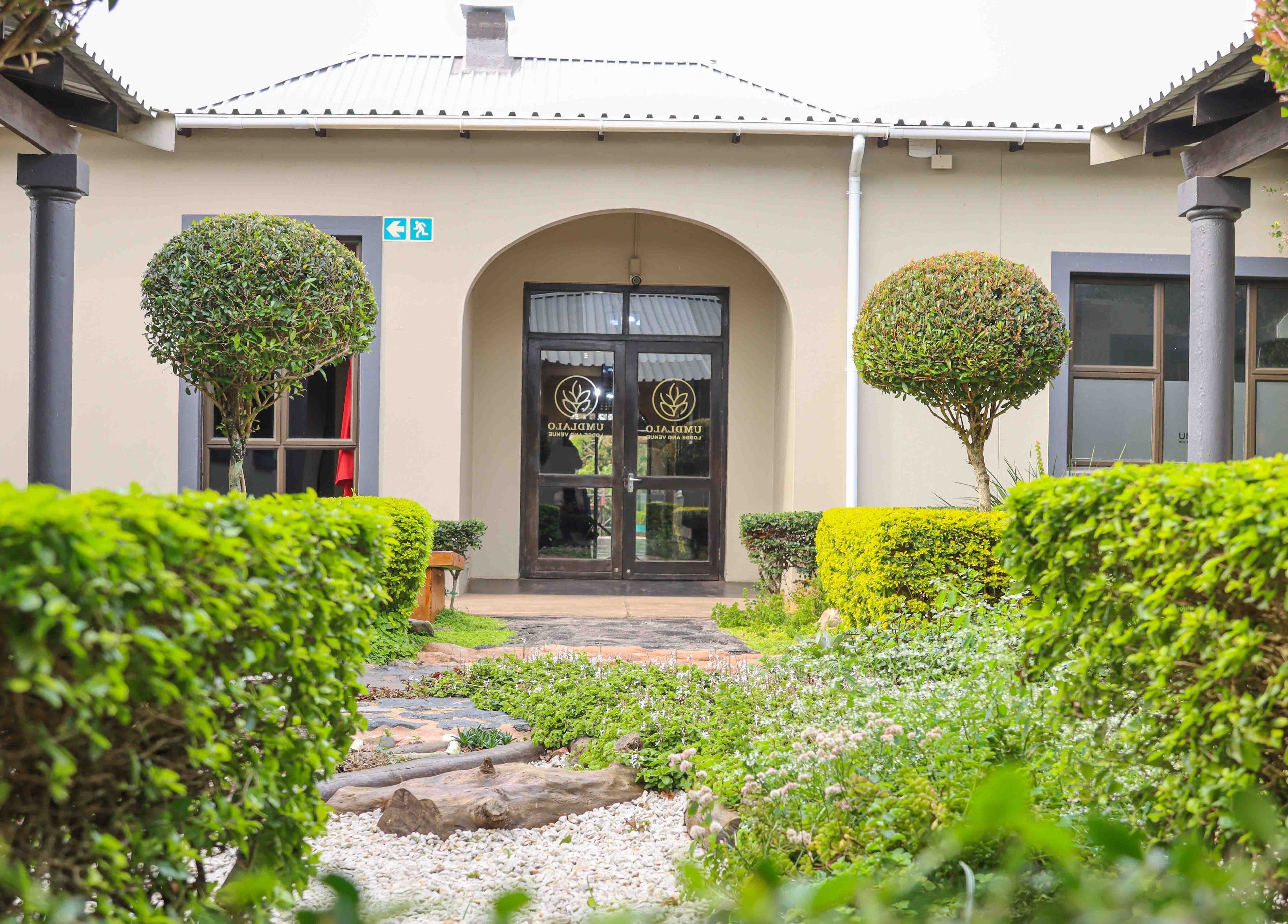 Lush gardens lead to Umdlalo Wellness entrance in Port Shepstone, Kwazulu-natal, ZA.