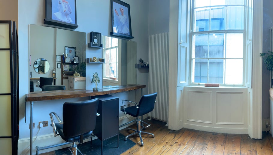 Modern salon setup with stylish chairs at The Hair Artist in Dublin, County Dublin, IE.