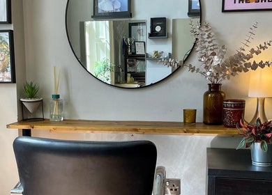 Elegant interior of The Hair Artist in Dublin, County Dublin, IE, featuring a stylish mirror and decor.