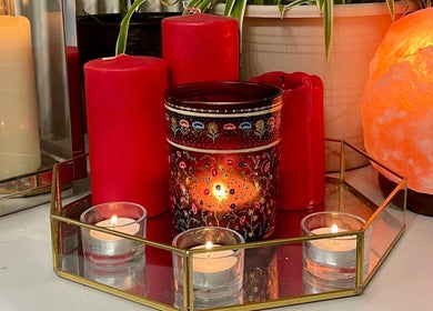 Red and white candles and a salt lamp at The Hair Artist, Dublin, County Dublin, IE, creating a warm ambiance.