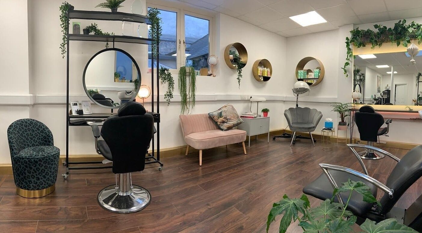 Interior of The Hair Artist salon in Dublin, County Dublin, IE featuring chic seating and elegant decor.