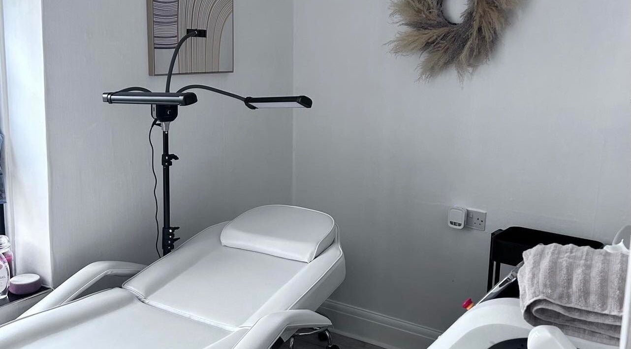 Relaxing treatment room at Pure Glow Clinic, Worthing, England, GB, featuring a modern reclining chair.