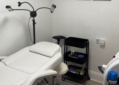Relaxing treatment room at Pure Glow Clinic in Worthing, England, GB, featuring modern wellness equipment.