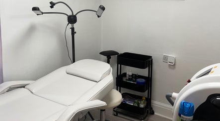 Relaxing treatment room at Pure Glow Clinic in Worthing, England, GB, featuring modern wellness equipment.
