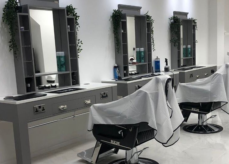 Modern barber stations at House Of Luxxe Barbers Ltd, Yate, England, GB, exuding a contemporary aesthetic.