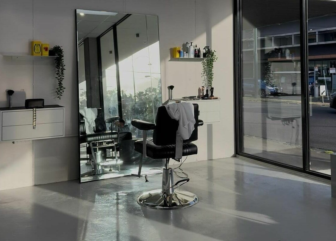 Chic interior of Studio Zero Essendon, Melbourne, Victoria, AU with styling chair and large windows.