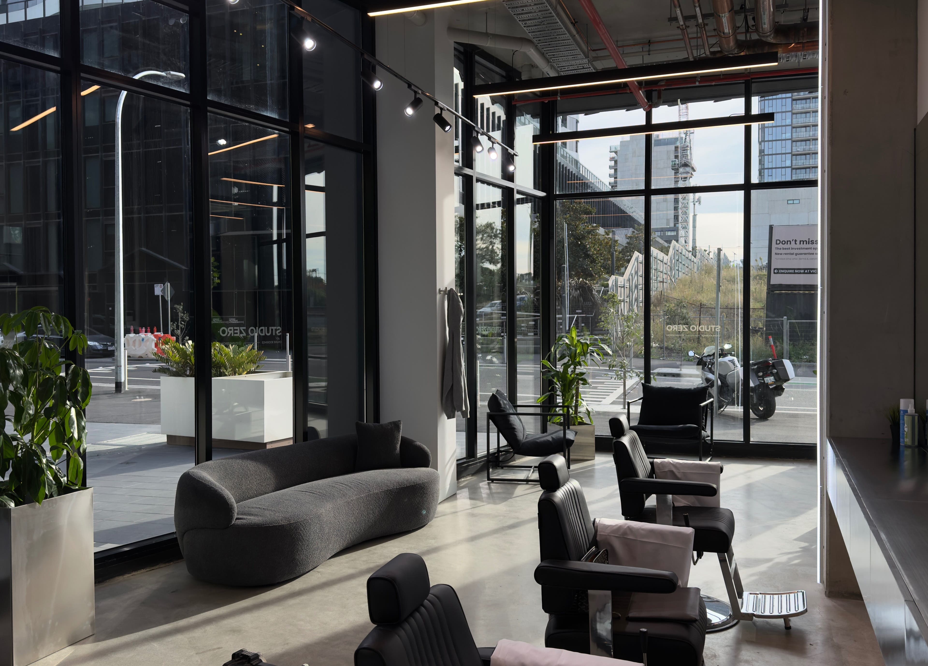 Chic interior of Studio Zero Footscray in Melbourne, Victoria, AU with modern seating and large windows.