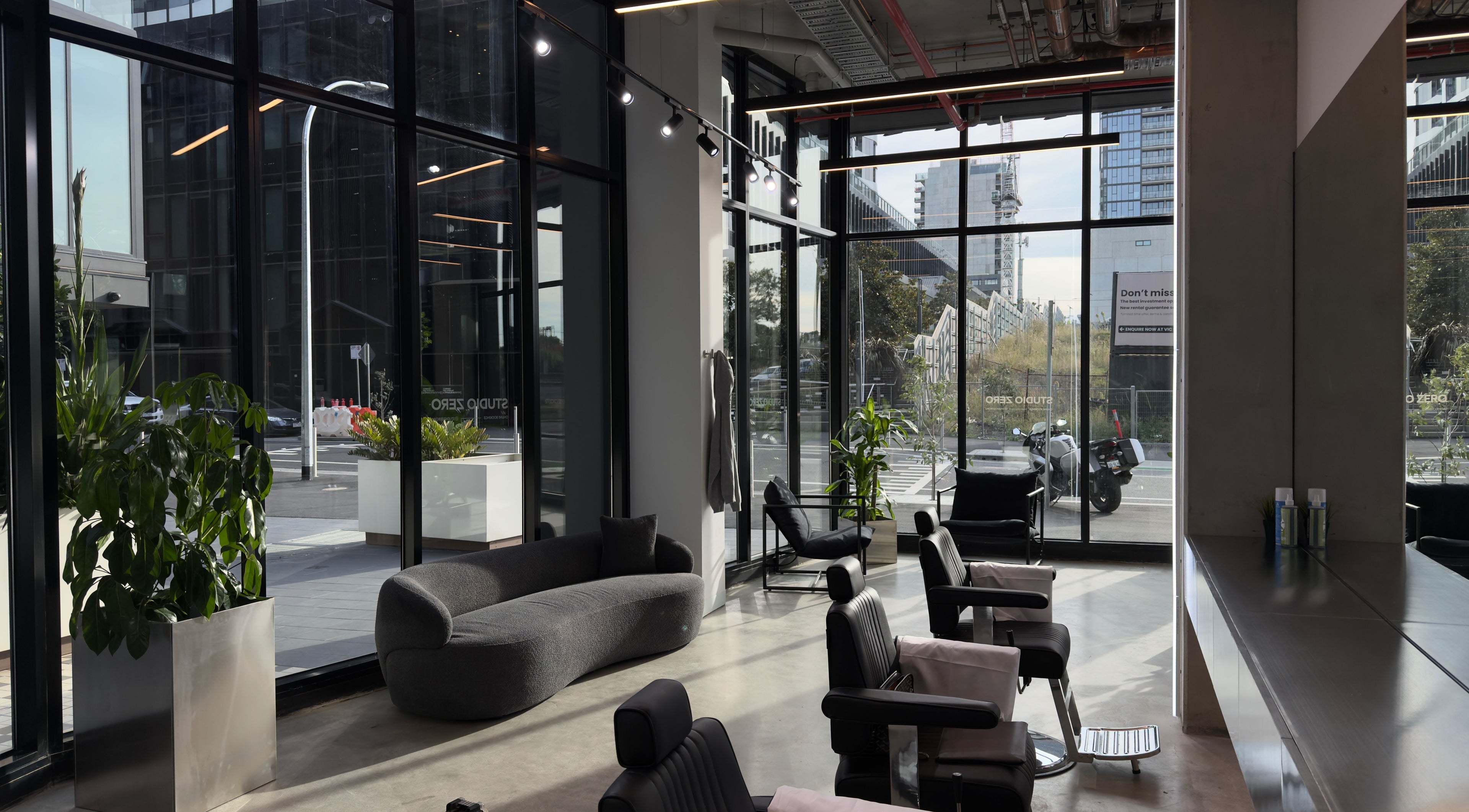 Chic interior of Studio Zero Footscray in Melbourne, Victoria, AU with modern seating and large windows.
