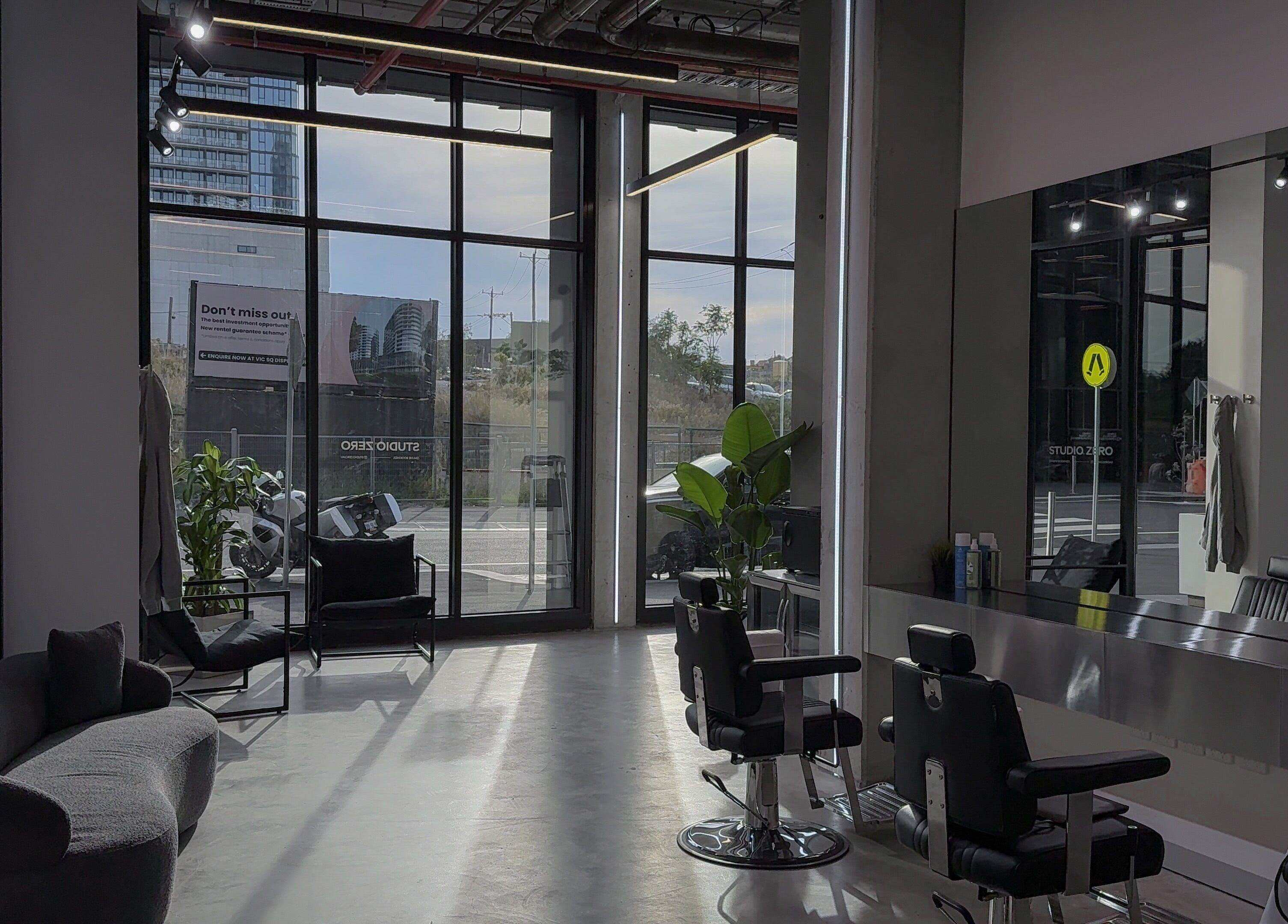 Modern interior of Studio Zero Footscray in Melbourne, Victoria, AU with chic seating and styling stations.