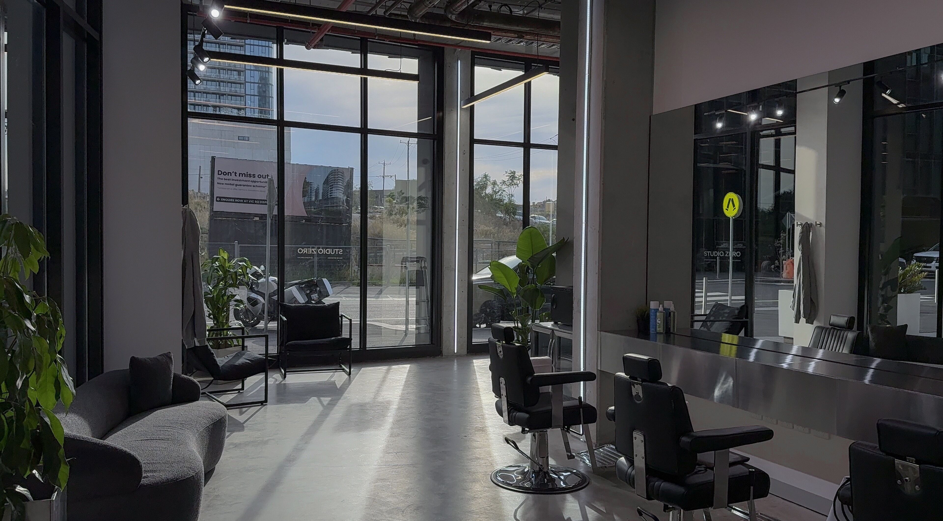 Modern interior of Studio Zero Footscray in Melbourne, Victoria, AU with chic seating and styling stations.