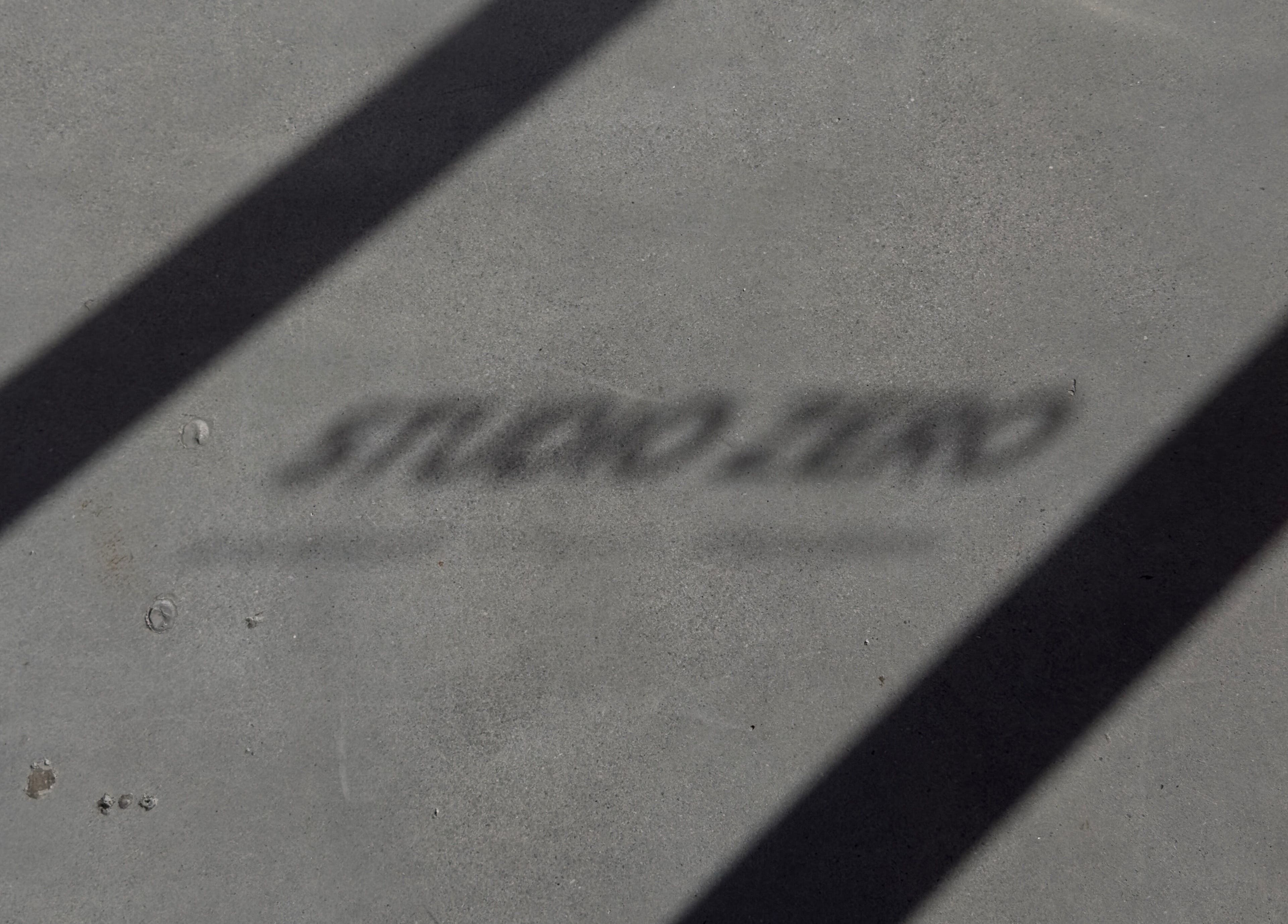 Shadow on floor spelling 'Studio Zero Footscray' at Melbourne, Victoria, AU.