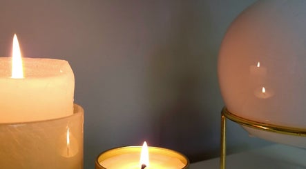 Tranquil candlelight setting at The Luxe Beauty in Stellenbosch, Western Cape, ZA creates calming wellness atmosphere.
