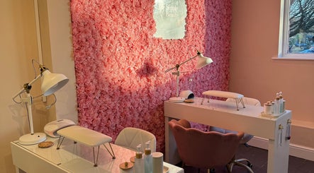 Elegant nail station at Simply Beauty Norwich, featuring a pink floral wall in Norwich, England, GB.
