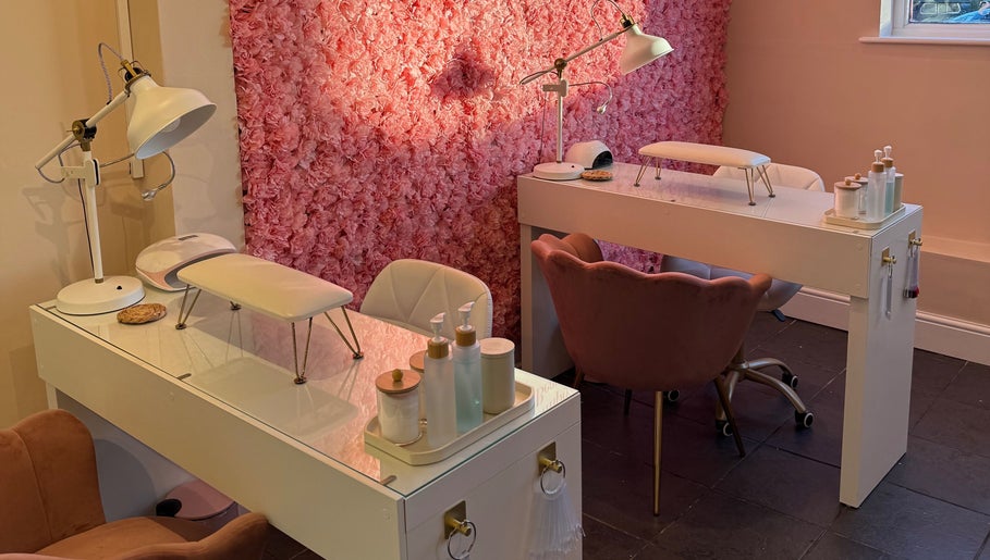 Manicure stations with pink floral wall at Simply Beauty Norwich, Norwich, England, GB.