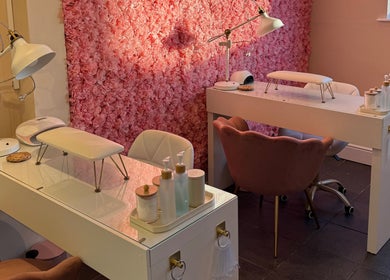 Manicure stations with pink floral wall at Simply Beauty Norwich, Norwich, England, GB.
