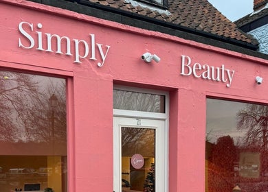 Simply Beauty Norwich storefront with pink facade in Norwich, England, GB.