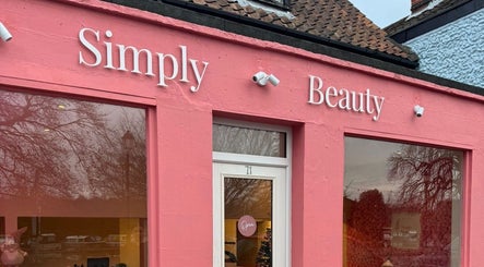 Simply Beauty Norwich storefront with pink facade in Norwich, England, GB.