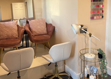 Relaxing seating area at Simply Beauty Norwich, showcasing elegant decor and pastel chairs in Norwich, England, GB.