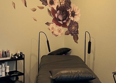 Tranquil treatment room at Moon Temple Esthetics - North Admiral, Seattle, Washington, US with floral wall art.