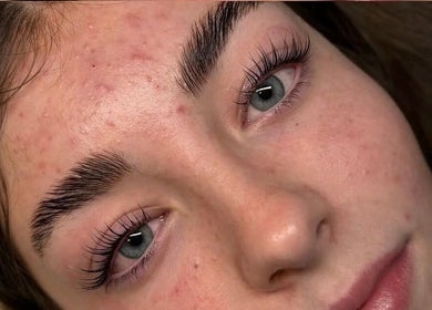Close-up of a woman's clear skin and lashes at Pixi Beauty, Doncaster, England, GB.