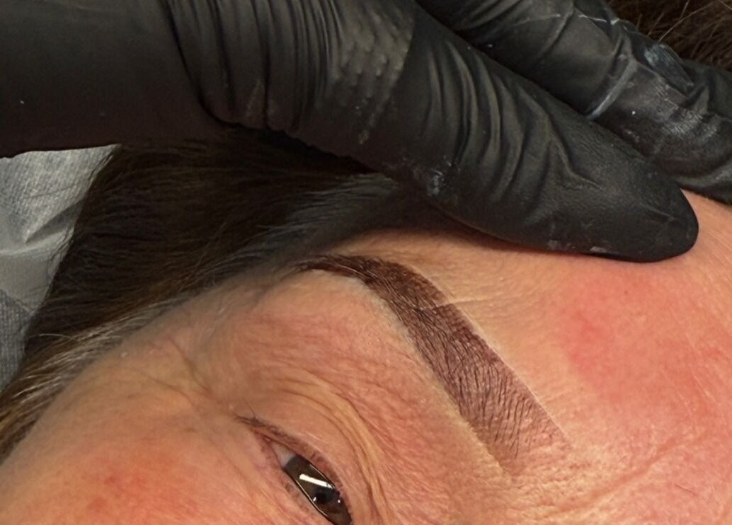 Close-up of eyebrow tattooing at SAINTLUXE BEAUTY in Melbourne, Victoria, AU by skilled technician.