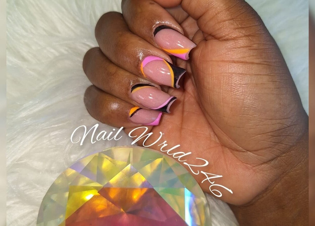 Bright nail design at Nailwrld246, Saint James, Saint James, BB. Hand with colorful manicure and gem.